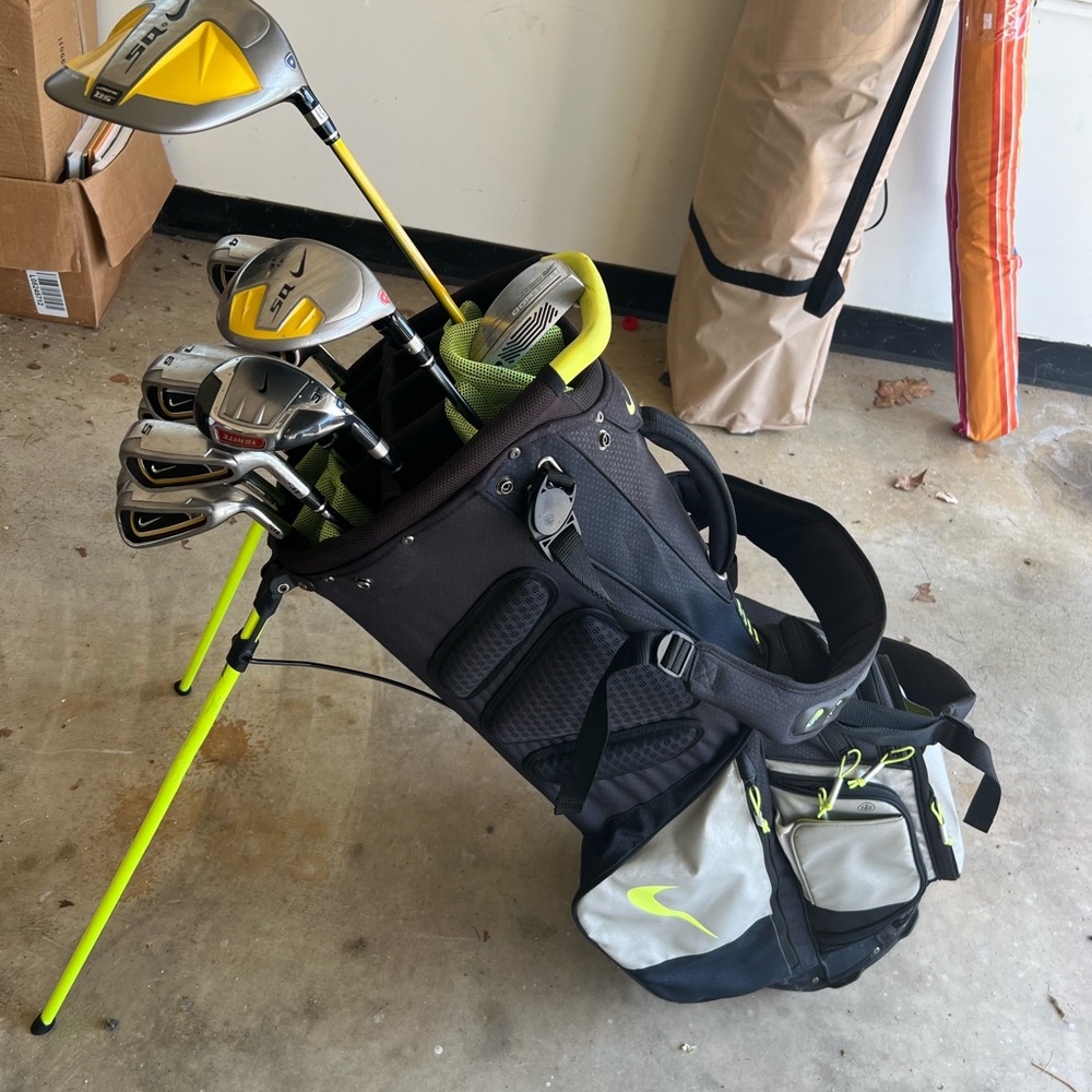 Nike Golf clubs. Includes: Nike sumo golf irons, bag, putter, 3wood and driver.